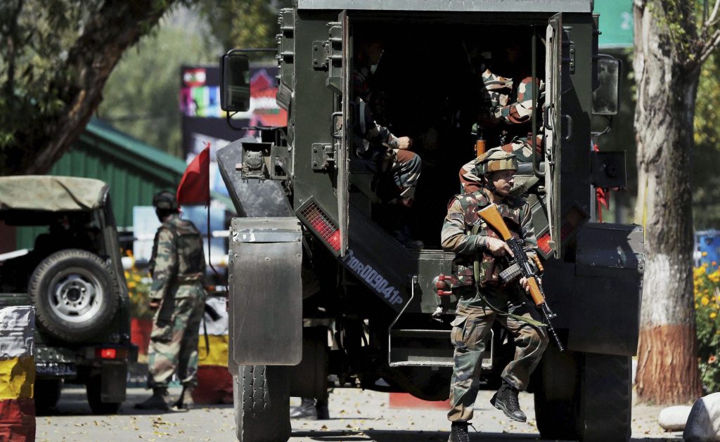 Uri: Army personnel in action inside the Army Brigade camp during a terror attack in Uri, Jammu and Kashmir on Sunday. PTI Photo(PTI9_18_2016_000154B)