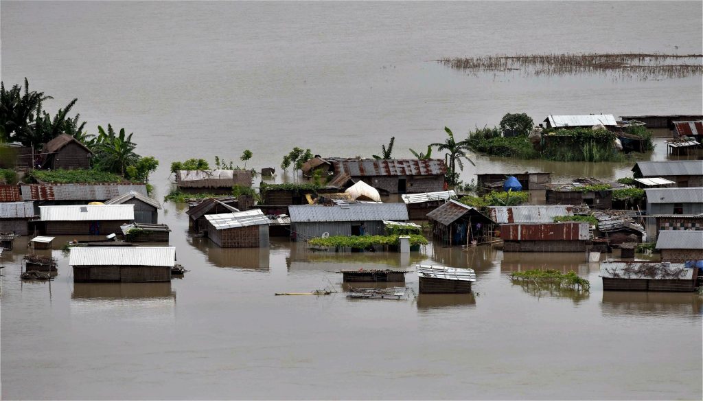 Morigaon: A view of the flooded Katoguri village in Morigaon district of Assam on Thursday. PTI Photo (PTI7_6_2017_000183B)