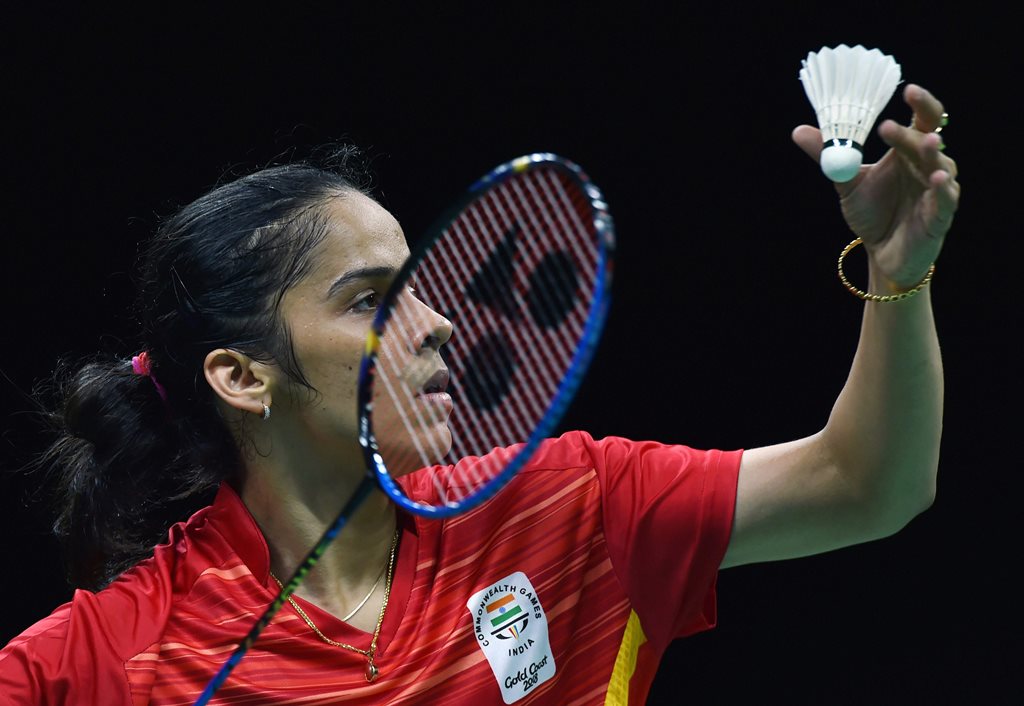 Gold Coast : India's Saina Nehwal returns a shot to Singapore's Jia Min Yeo during the women's singles of Badminton Mixed Team Semifinals match at the Commonwealth Games 2018 in Gold Coast, Australia on Sunday. PTI Photo by Manvender Vashist (PTI4_8_2018_000023B)