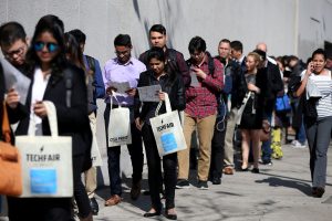 Job applicants wait in line at a technology job fair in Los Angeles. Photo: Reuters