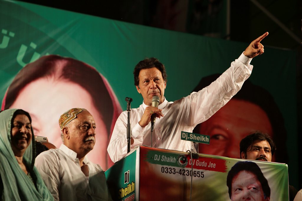 Lahore : Pakistani politician Imran Khan, chief of Pakistan Tehreek-e-Insaf party, addresses his supporters during an election campaign in Lahore, Pakistan, Monday, July 23, 2018. Pakistan will hold general elections on July 25. AP/PTI(AP7_24_2018_000002B)