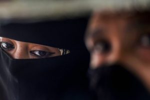 New Delhi: A Muslim woman looks on, near Jama Masjid in New Delhi, Wednesday, Sept 19, 2018. The Union Cabinet approved an ordinance to ban the practice of instant triple talaq. Under the proposed ordinance, giving instant triple talaq will be illegal and void and will attract a jail term of three years for the husband. (PTI Photo/Atul Yadav) (Story No. TAR20) (PTI9_19_2018_000096B)