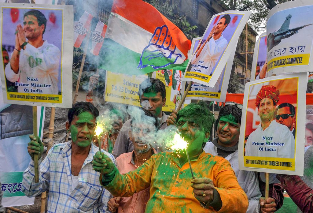 Kolkata: Congress workers celebrate the party's good show in the Assembly elections of Rajasthan, Chhattisgarh and Madhya Pradesh, in Kolkata, Tuesday, Dec. 11, 2018. (PTI Photo)   (PTI12_11_2018_000141)