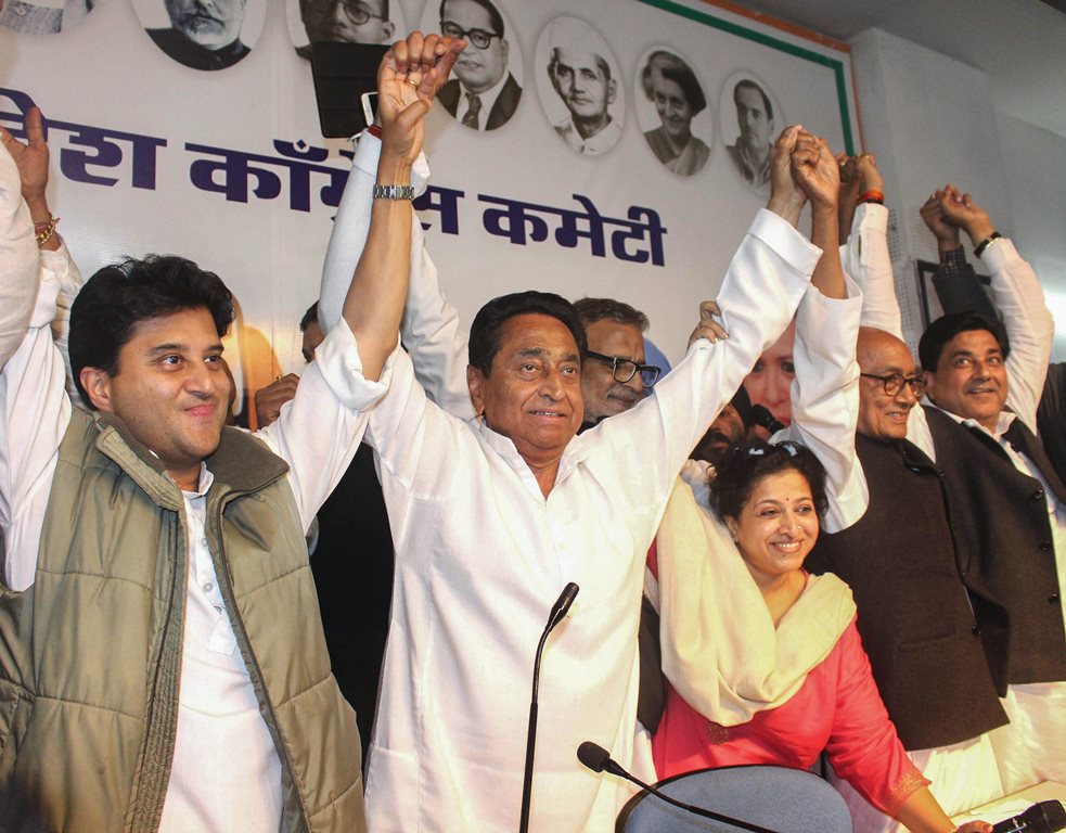 Bhopal: Congress State President Kamal Nath, party leaders Jyotiraditya Scindia, Digvijaya Singh and other leaders display victory sign after the party's win in state Assembly elections, at PCC headquarters, in Bhopal, Wednesday early morning, Dec. 12, 2018. (PTI Photo)(PTI12_12_2018_000055)