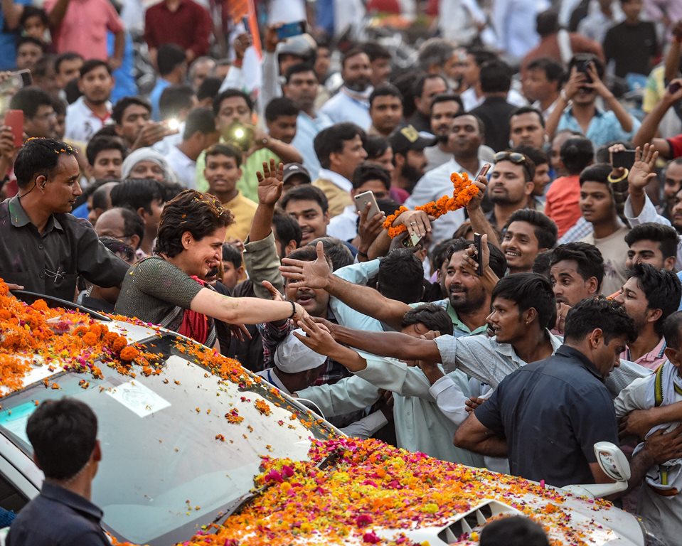 Ayodhya: Congress General Secretary and Uttar Pradesh - East incharge Priyanka Gandhi Vadra greets her supporters during a roadshow on the last day of her 3-day campaign ahead of Lok Sabha elections, in Ayodhya, Friday, March 29, 2019. (PTI Photo/Nand Kumar) (PTI3_29_2019_000138B)