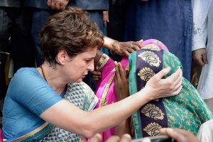 Mirzapur: Congress General Secretary Priyanka Gandhi Vadra consoles a family member of Sonbhadra massacre victim, who had travelled to Chunar Fort to meet her after the former was stopped from proceeding to Sonbhadra, in Mirzapur, Saturday, July 20, 2019. Aleast 10 people were killed in a shootout on Wednesday over a land dispute in Sonbhadra. (PTI Photo)(PTI7_20_2019_000039B)