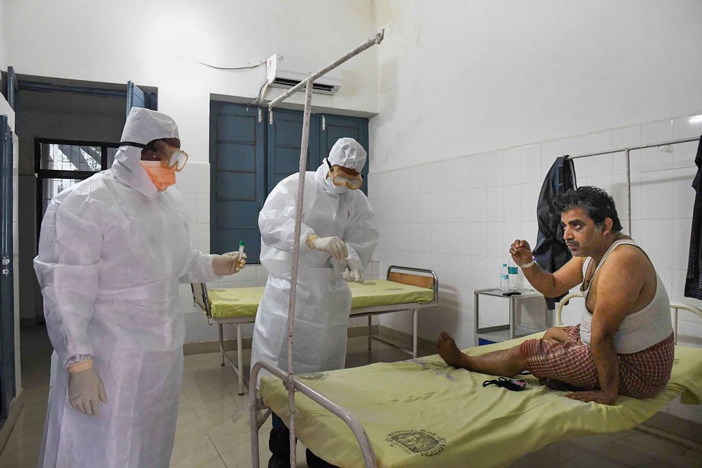 Patna: Medics take samples from a patient in the isolation ward of novel coronavirus (COVID-19) at Patna Medical College and Hospital (PMCH) in Patna, Saturday, March 14, 2020. (PTI Photo)(PTI14-03-2020_000040B)