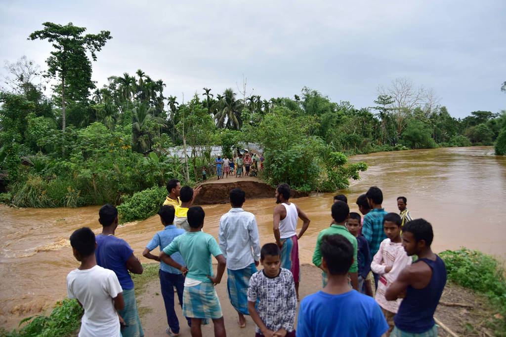 Nagaon: Villagers watch a washed away road after flooding by Borpani River due to incessant rainfall for the past two days, at Madhab Para near Kampur in Nagaon district of Assam, Friday, May 22, 2020. (PTI Photo) (PTI22-05-2020 000084B)