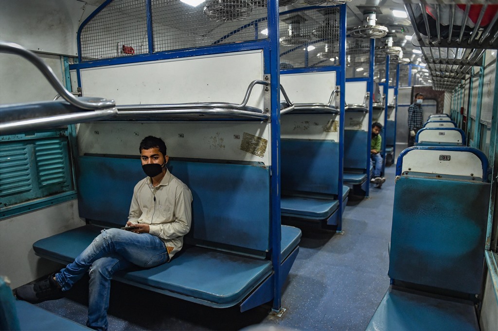 Lucknow: Passengers sit in a coach of the first special train leaving for New Delhi from the Charbagh Railway Station after the end of COVID-19 lockdown 4.0, in Lucknow, Monday, June 1, 2020. Indian Railways has resumed operations of 200 passenger trains from June 1. (PTI Photo/ Nand Kumar) (PTI01-06-2020_000046B)
