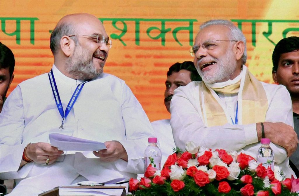 Kozhikode: Prime Minister Narendra Modi with BJP President Amit Shah during BJP's National Council Meeting at Kozhikode on Sunday. PTI Photo (PTI9_25_2016_000140B) *** Local Caption ***