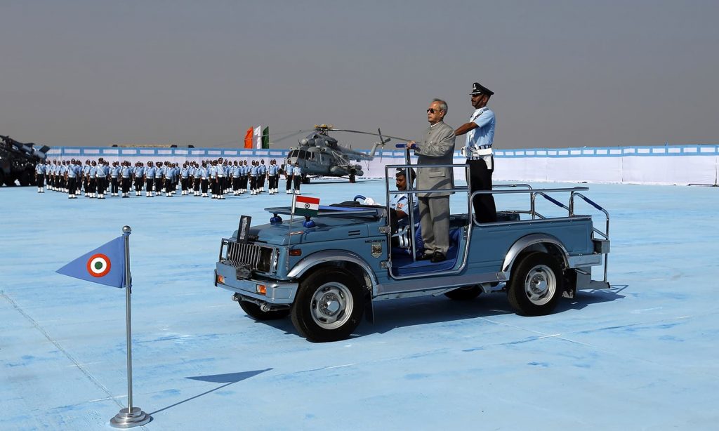 Indian President Pranab Mukherjee (front) watches as the Air warrior drill team perform during the President's Standard Presentation (PSP) held at Jamnagar Air Force Station in the western state of Gujarat, India March 4, 2016. REUTERS/Amit Dave