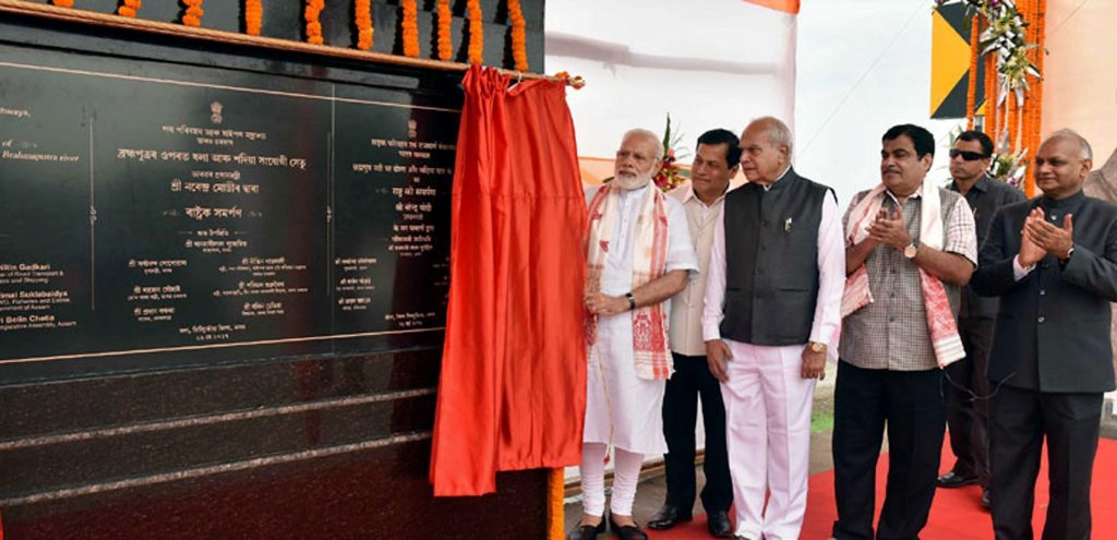 Sadia: Prime Minister Narendra Modi unveiling the plaque to mark the dedication to the nation of the Dhola-Sadia Bridge, across River Brahmaputra, in Assam on Friday. Assam Governor Banwarilal Purohit, the Union Minister for Road Transport & Highways and Shipping Nitin Gadkari and the Chief Minister of Assam Sarbananda Sonowal are also seen. PTI Photo (PTI5_26_2017_000164B)