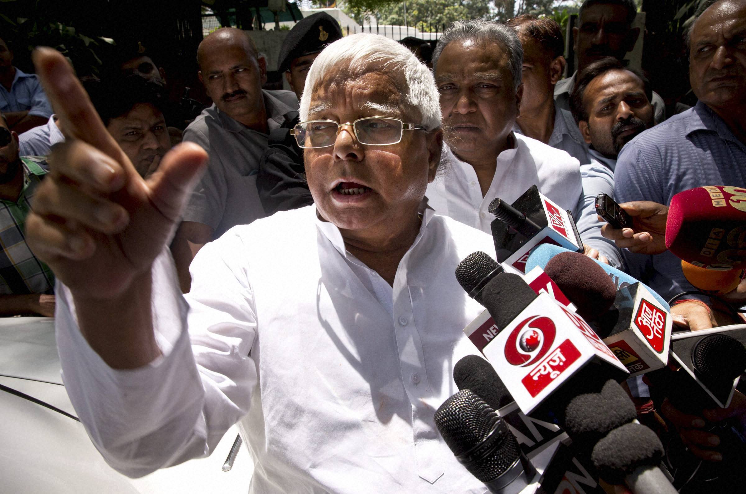 New Delhi: Rashtriya Janata Dal (RJD) leader Lalu Prasad Yadav speaks to reporters after a meeting with Samajwadi Party (SP) leader Mulayam Singh Yadav in New Delhi on Friday. The leaders reportedly met to sort out seat sharing issues ahead of the Bihar state elections, expected later this year. PTI Photo (PTI5_22_2015_000098B)