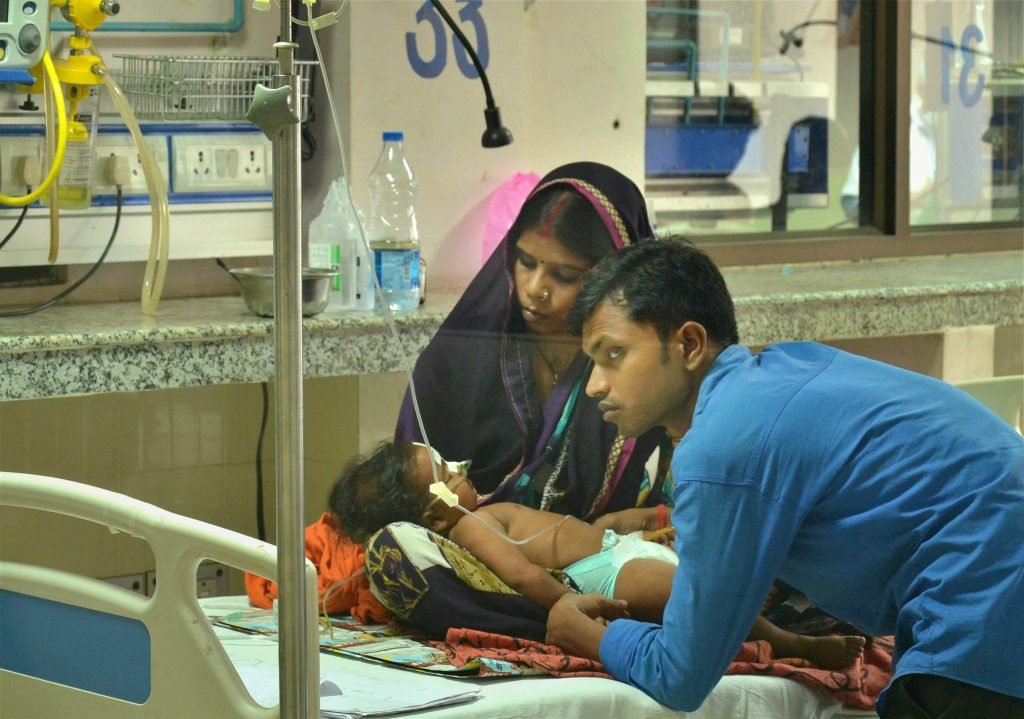 Gorakhpur: A child receives treatments in the Encephalitis Ward at the Baba Raghav Das Medical College Hospital in Gorakhpur district on Sunday. More than 30 children have died at the hospital in the span of 48 hours. PTI Photo (PTI8_13_2017_000201A)