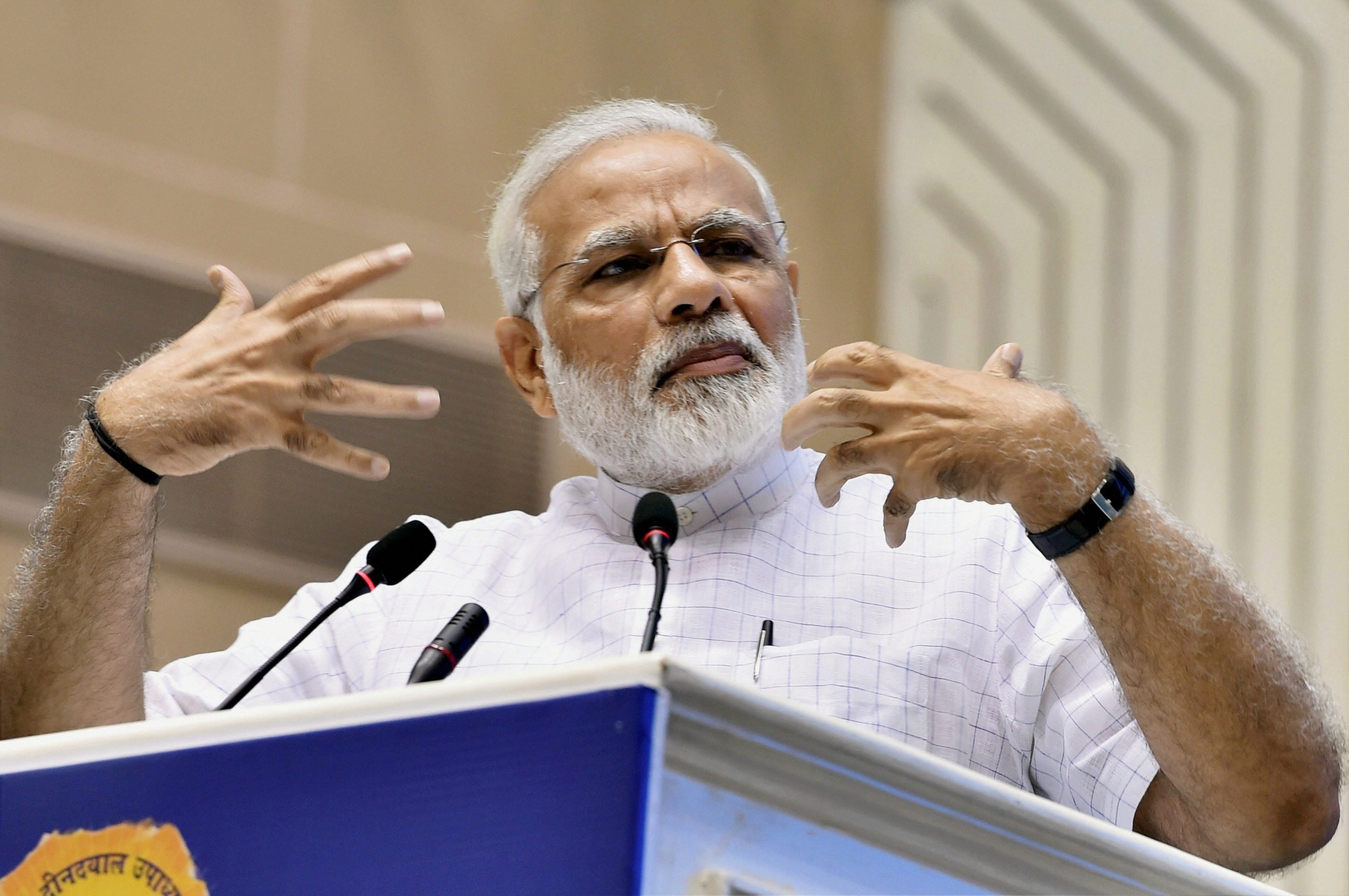New Delhi: Prime Minister Narendra Modi addresses during a function on the occasion of 125th anniversary of Vivekananda's Chicago Address and birth centenary of Deendayal Upadhyay in New Delhi on Monday. PTI Photo by Shahbaz Khan (PTI9_11_2017_000061A)