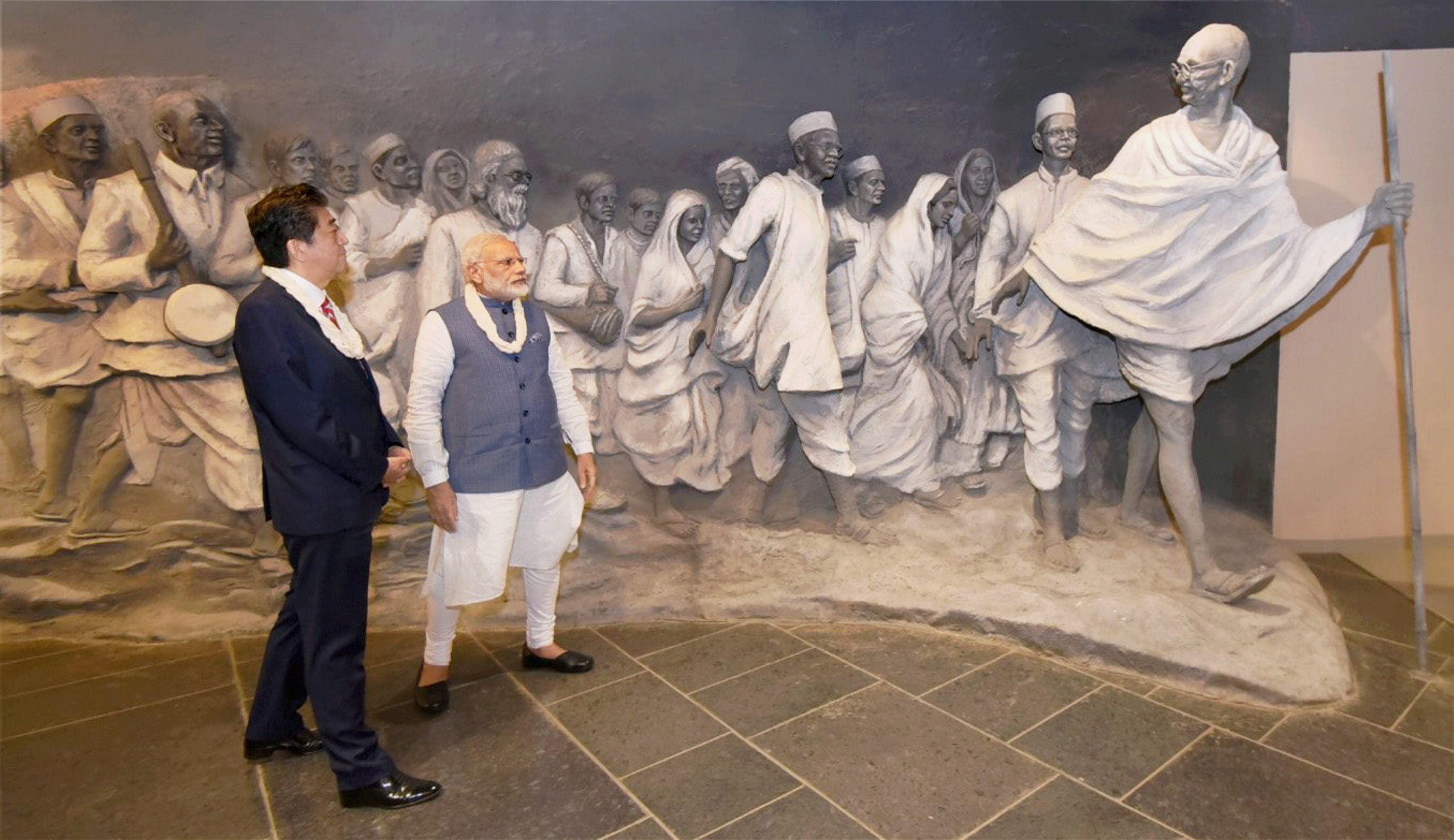 Gandhinagar: Prime Minister Narendra Modi and his Japanese counterpart, Shinzo Abe during their visit to Dandi Kutir, in Gandhinagar on Thursday. PTI Photo/ PIB(PTI9_14_2017_000056A)