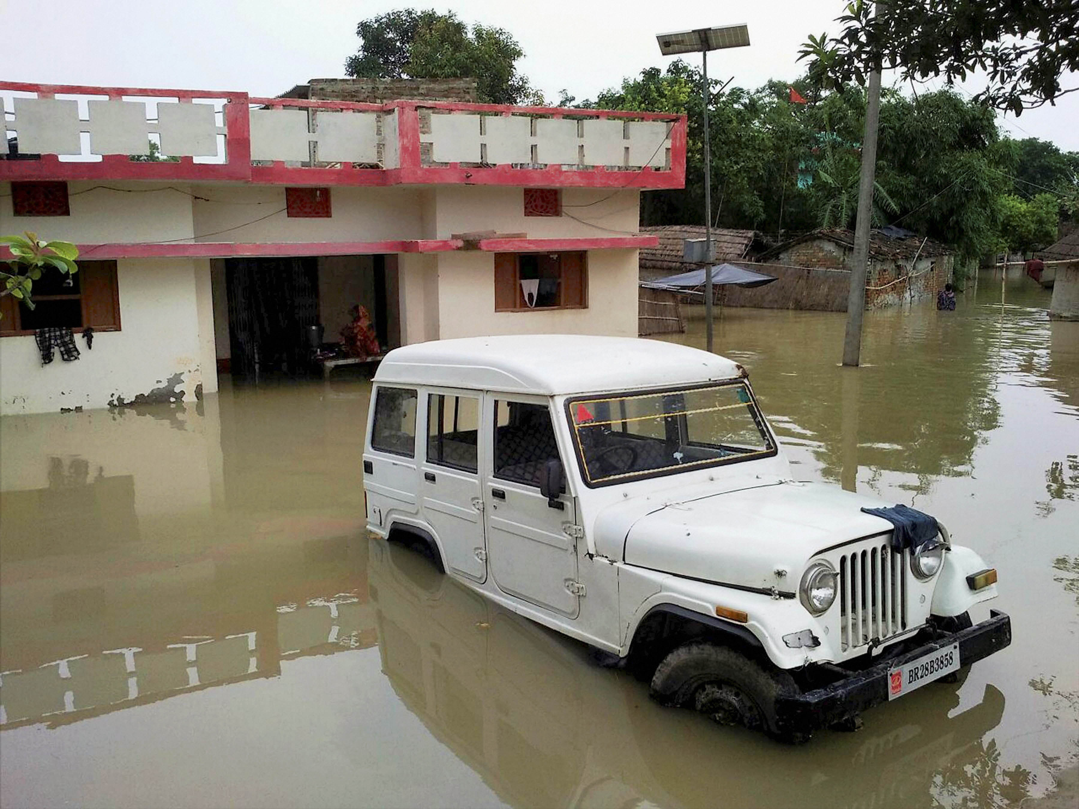 Gopalganj: A view of a flood-affected village in Gopalganj district of Bihar on Wednesday. PTI Photo(PTI8_16_2017_000088B)