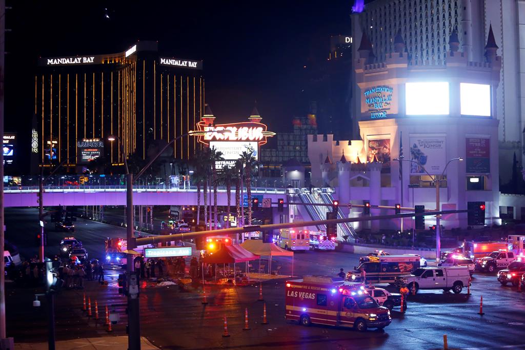 Las Vegas Metro Police and medical workers stage in the intersection of Tropicana Avenue and Las Vegas Boulevard South after a mass shooting at a music festival on the Las Vegas Strip in Las Vegas, Nevada, U.S. October 1, 2017. REUTERS/Las Vegas Sun/Steve Marcus - RC1BEC59EC90