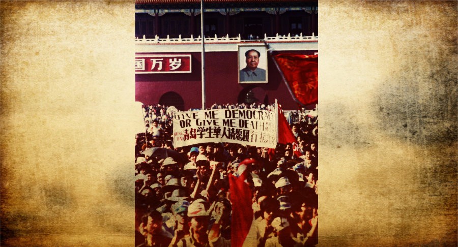 Chinese students carry a sign that reads, "Give me democracy or give me death," during a demonstration in Tiananmen Square May 14, 1989. DOMINIC DUDOUBLE/REUTERS