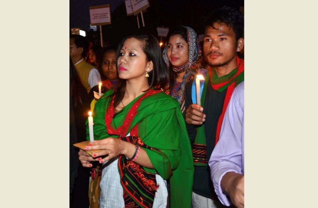 Guwahati: People take part in a candlelight march against the death of two protesters killed in police firing while they were protesting against the inclusion of Dima Hasong land in Naga Accord, in Guwahati on Saturday. PTI Photo (PTI1_27_2018_000177B)