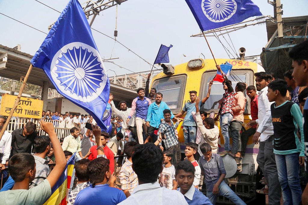 Mumbai: Dalit groups protesting at Thane railway station during the Maharashtra Bandh on Wednesday following clashes between two groups in Bhima Koregaon near Pune, in Mumbai. PTI Photo(PTI1_3_2018_000115B)