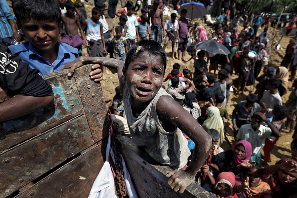 Rohingya refugees react as aid is distributed in Cox's Bazar, Bangladesh, on Thursday. Cathal McNaughton, Reuters (Sep 21 2017)