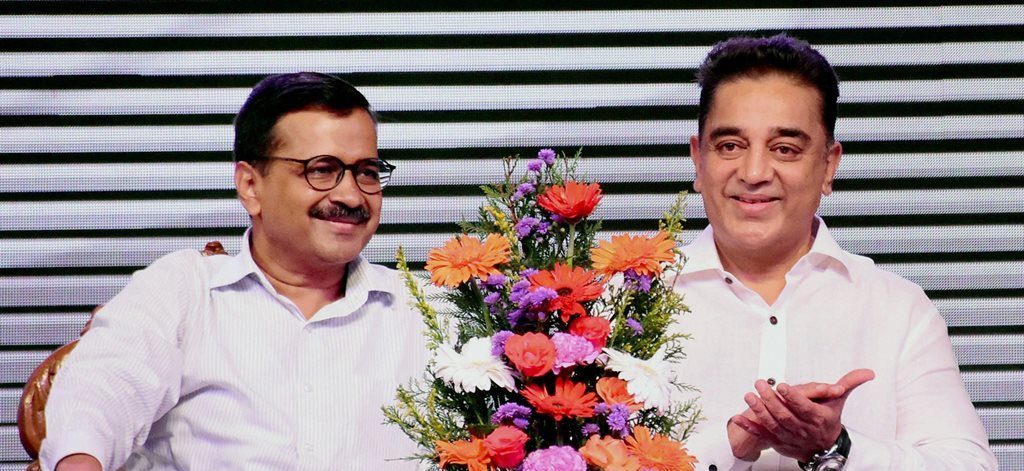 Madurai: Tamil film icon Kamal Haasan with Delhi Chief Minister Arvind Kejriwal during the launch of political party "Makkal Neethi Maiam" in Madurai on Wednesday. PTI Photo(PTI2_21_2018_000227B)