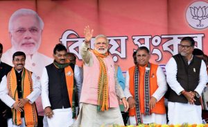 Sonamura: Prime Minister Narendra Modi waves at the public during an election campaign rally ahead of Tripura Assembly Election in Sonamura on Thursday. PTI Photo (PTI2_8_2018_000075B)