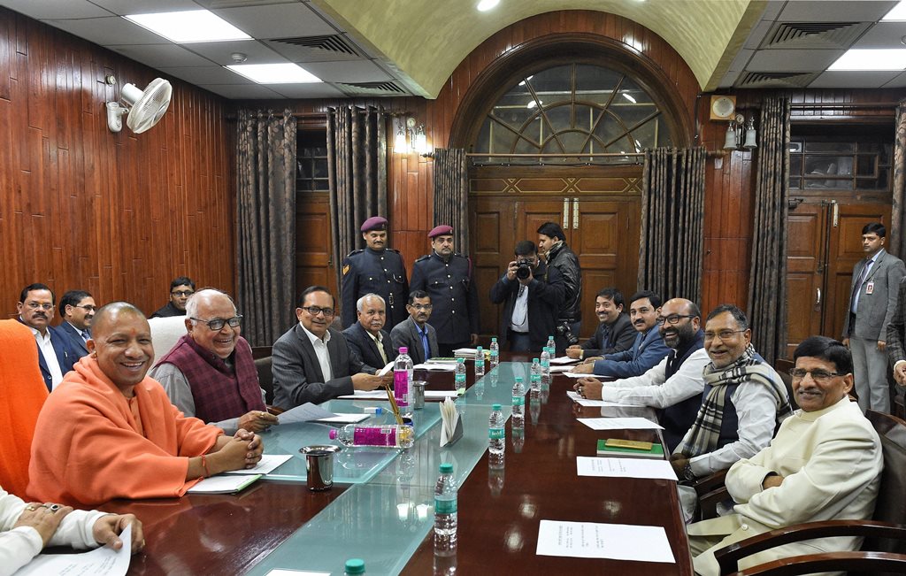 Lucknow: Uttar Pradesh Chief Minister Yogi Adityanath and Assembly Speaker HN Dixit along with others during an all-party meeting ahead of Budget Session of state assembly in Lucknow on Wednesday. PTI Photo by Nand Kumar (PTI2_7_2018_000166B)