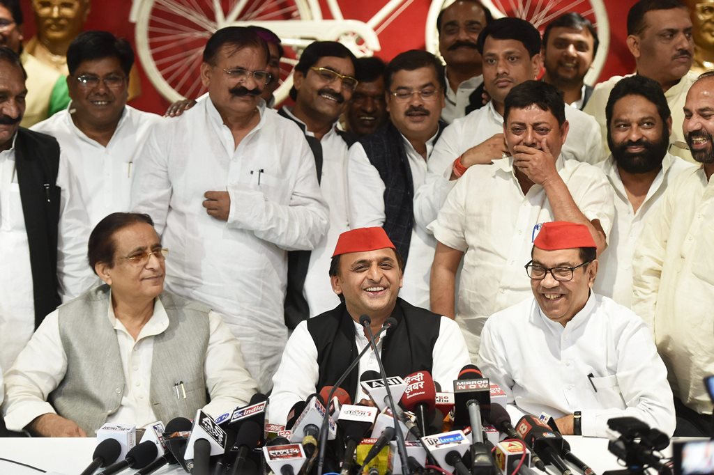 Lucknow: Samajwadi Party president Akhilesh Yadav with senior leaders Kiranmoy Nanda and Azam Khan addresses a press conference after the by-election results, at the party headquarters in Lucknow on Wednesday. PTI Photo by Nand Kumar (PTI3_14_2018_000160B)