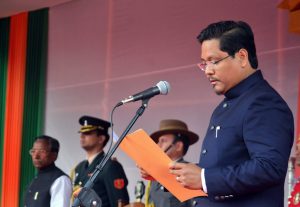 Shillong: National People's Party (NPP) President Conrad K Sangma takes oath as Meghalaya Chief Minister during swearing-in ceremony as Meghalaya Governor Ganga Prasad looks on, in Shillong on Tuesday. PTI Photo (PTI3_6_2018_000046B)