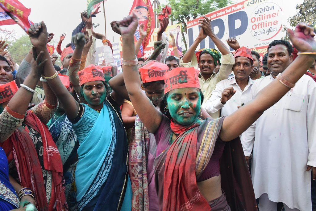Gorakhpur: Samajwadi Party member celebrate the success of their party in the Lok Sabha bypoll elections, in Gorakhpur on Wednesday. PTI photo(PTI3_14_2018_000153B)