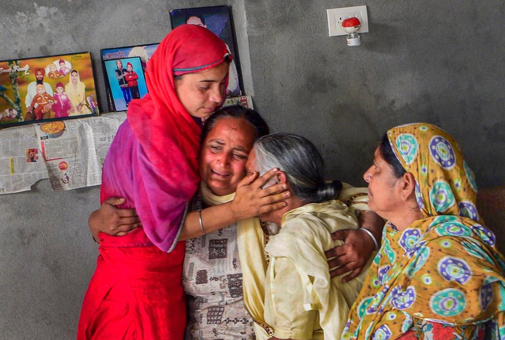 Amritsar: Family members of one of the 39 Indian workers feared killed in Iraq, grieve at their home on the outskirts of Amritsar on Tuesday. External Affairs Minister Sushma Swaraj in a statement made at Rajya Sabha today, stated that the 39 bodies exhumed from a mount in Badoosh in Iraq have been identified as those of abducted Indians and will be brought back to India on a special plane. PTI Photo(PTI3_20_2018_000156B)