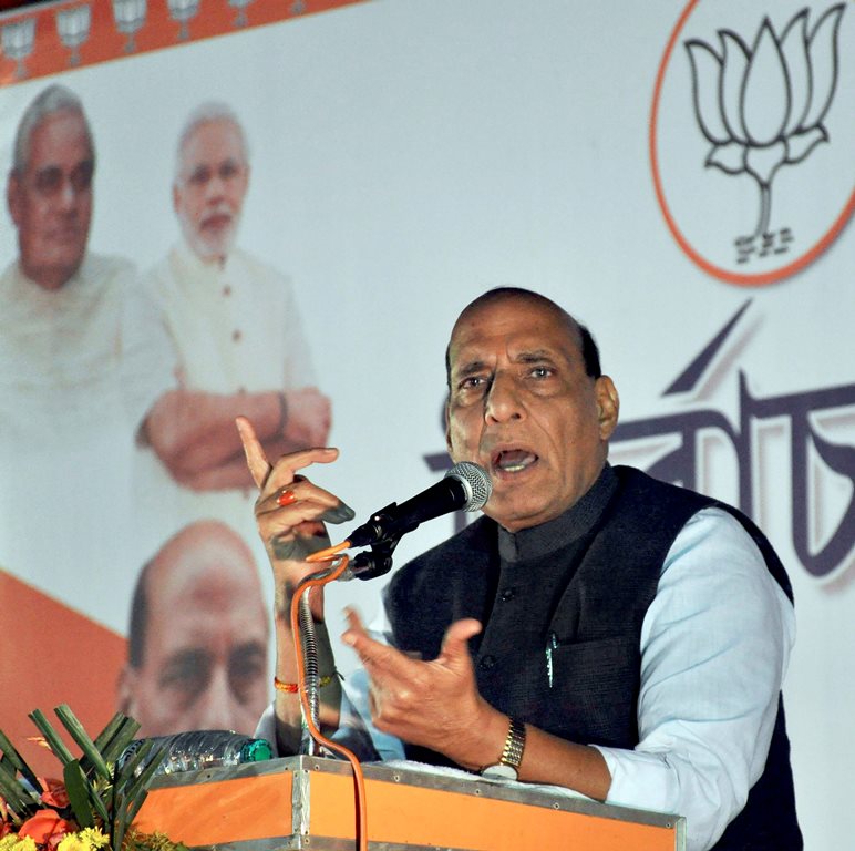 Agartala: Home Minister Rajnath Singh addresses a gathering during the Tripura assembly election campaign, at Agartala on Saturday. PTI Photo (PTI2_3_2018_000169B)