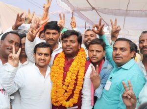 Gorakhpur: Samajwadi Party candidate Praveen Kumar Nishad flashes victory sign after his success in the bypoll elections, in Gorakhpur on Wednesday. PTI photo(PTI3_14_2018_000163B)