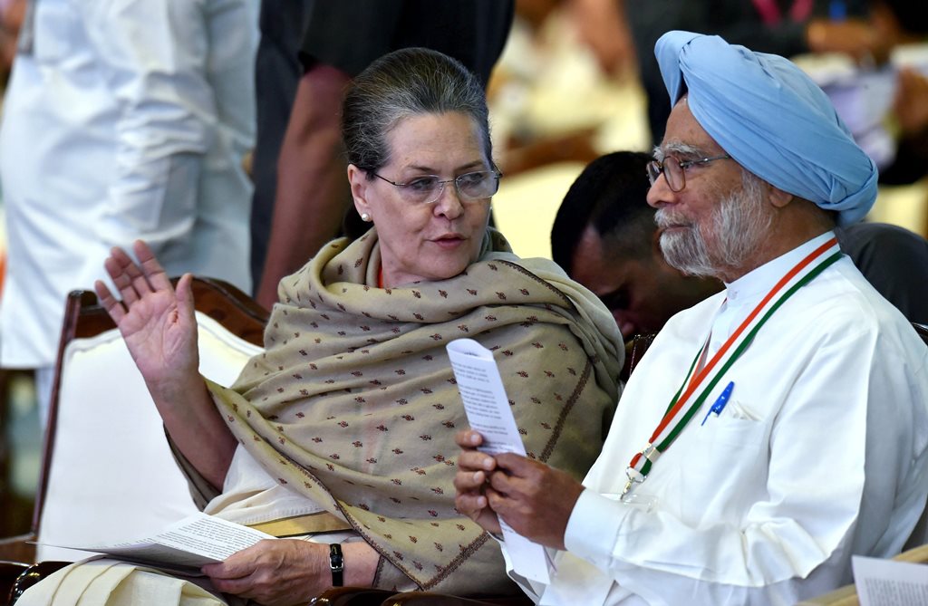 New Delhi: Chairperson of Congress Parliamentary Party, Sonia Gandhi speaks with former Prime Minister Manmohan Singh during the 84th Plenary Session of Indian National Congress(INC) at Indira Gandhi Stadium in New Delhi, on Saturday. PTI Photo by Manvender Vashist (PTI3_17_2018_000098B)