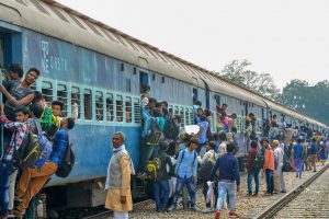 Mathura: Passengers travel in an overcrowded train ahead of Holi festival in Mathura on Thursday. PTI Photo (PTI3_1_2018_000196B)