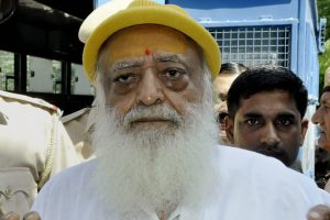 **FILE** New Delhi: File photo of Asaram Bapu being produced in Jodhpur court in connection with the sexual harassment case. A Jodhpur court on Wednesday convicted self-styled godman Asaram of raping a minor girl at his ashram in Rajasthan in 2013. PTI Photo PTI Photo(PTI4_25_2018_000033B)