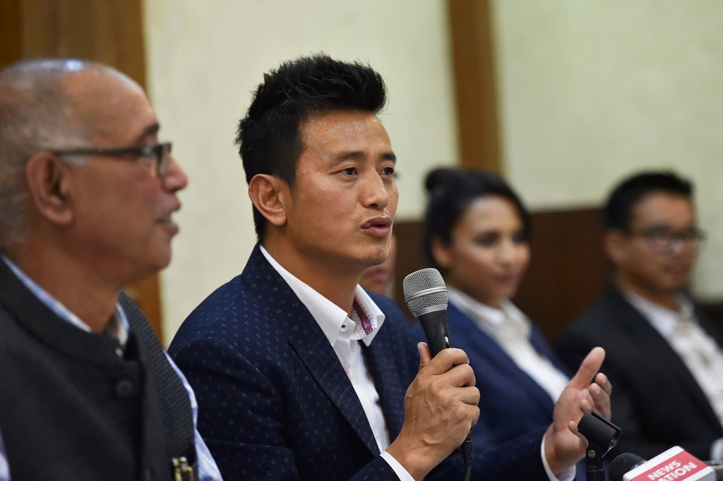 New Delhi: Former Indian football team captain Bhaichung Bhutia speaks during the launch of his political party 'Hamro Sikkim' during a press conference in New Delhi on Thursday. PTI Photo by Arun Sharma (PTI4_26_2018_000103B)