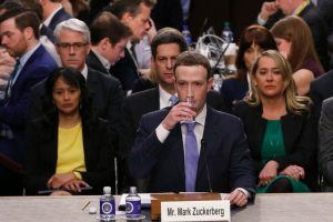 Facebook CEO Mark Zuckerberg takes a drink while testifying before a Senate Judiciary and Commerce Committees joint hearing regarding the company?s use and protection of user data on Capitol Hill in Washington, U.S., April 10, 2018. REUTERS/Alex Brandon/Pool