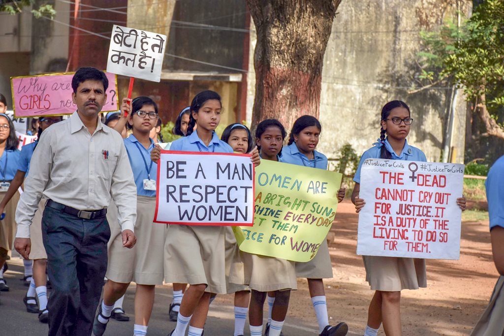 Ranchi: Students hold placards during a protest march against recent cases of rape in the country, in Ranchi on Tuesday. PTI Photo (PTI4_24_2018_000036B)