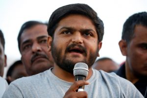 Ahmedabad: PAAS convener Hardik Patel addresses people during protest against Rape of 8yr old girl in Kathua of Jammu-Kashmir, 11 yr old girl in Unnao of Uttar Pradesh and also in Surat and demanding to hang rapists, in Ahmedabad on Sunday. PTI Photo (PTI4_22_2018_000167B)