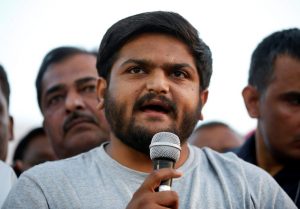 Ahmedabad: PAAS convener Hardik Patel addresses people during protest against Rape of 8yr old girl in Kathua of Jammu-Kashmir, 11 yr old girl in Unnao of Uttar Pradesh and also in Surat and demanding to hang rapists, in Ahmedabad on Sunday. PTI Photo (PTI4_22_2018_000167B)