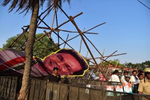 Bengaluru: Cut outs of Chief Minister Siddaramaiah and other leaders collapse during a public rally of Congress president Rahul Gandhi on the last day of his Jana Aashirwada Yatra ahead of Karnataka Assembly elections in Bengaluru on Sunday. PTI Photo by Shailendra Bhojak (PTI4_8_2018_000245B)