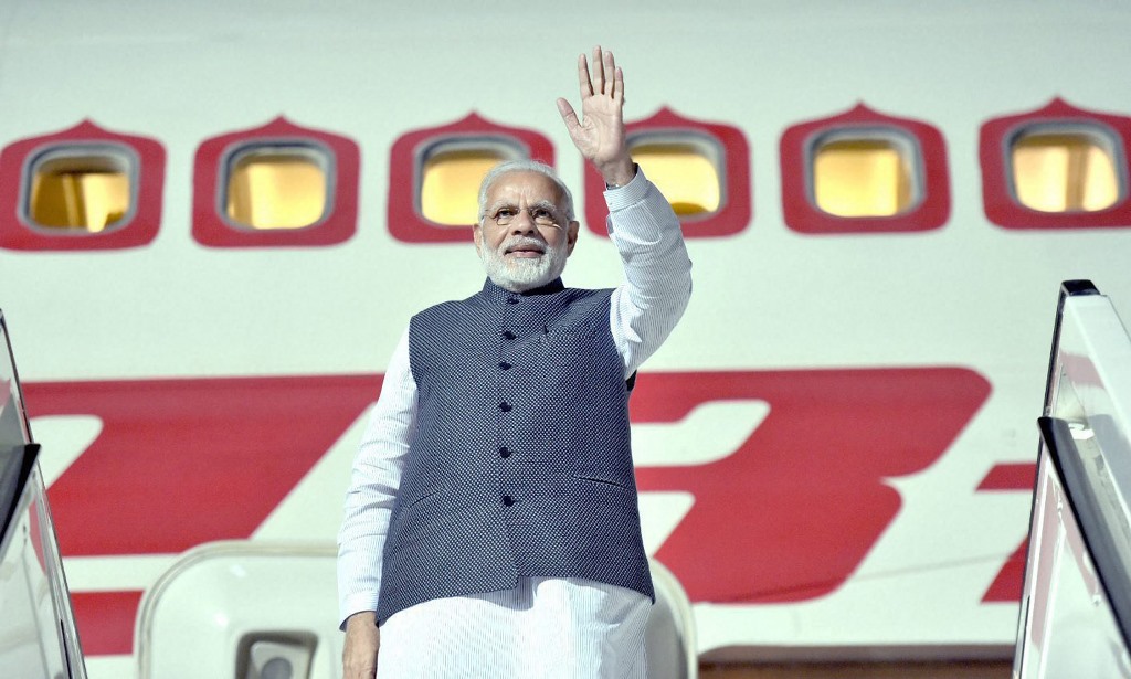 New Delhi: Prime Minister Narendra Modi waves as leaves for Delhi from Berlin after a three-nation tour, in New Delhi on Saturday. PTI Photo PTI Photo / PIB(PTI4_21_2018_000024B)