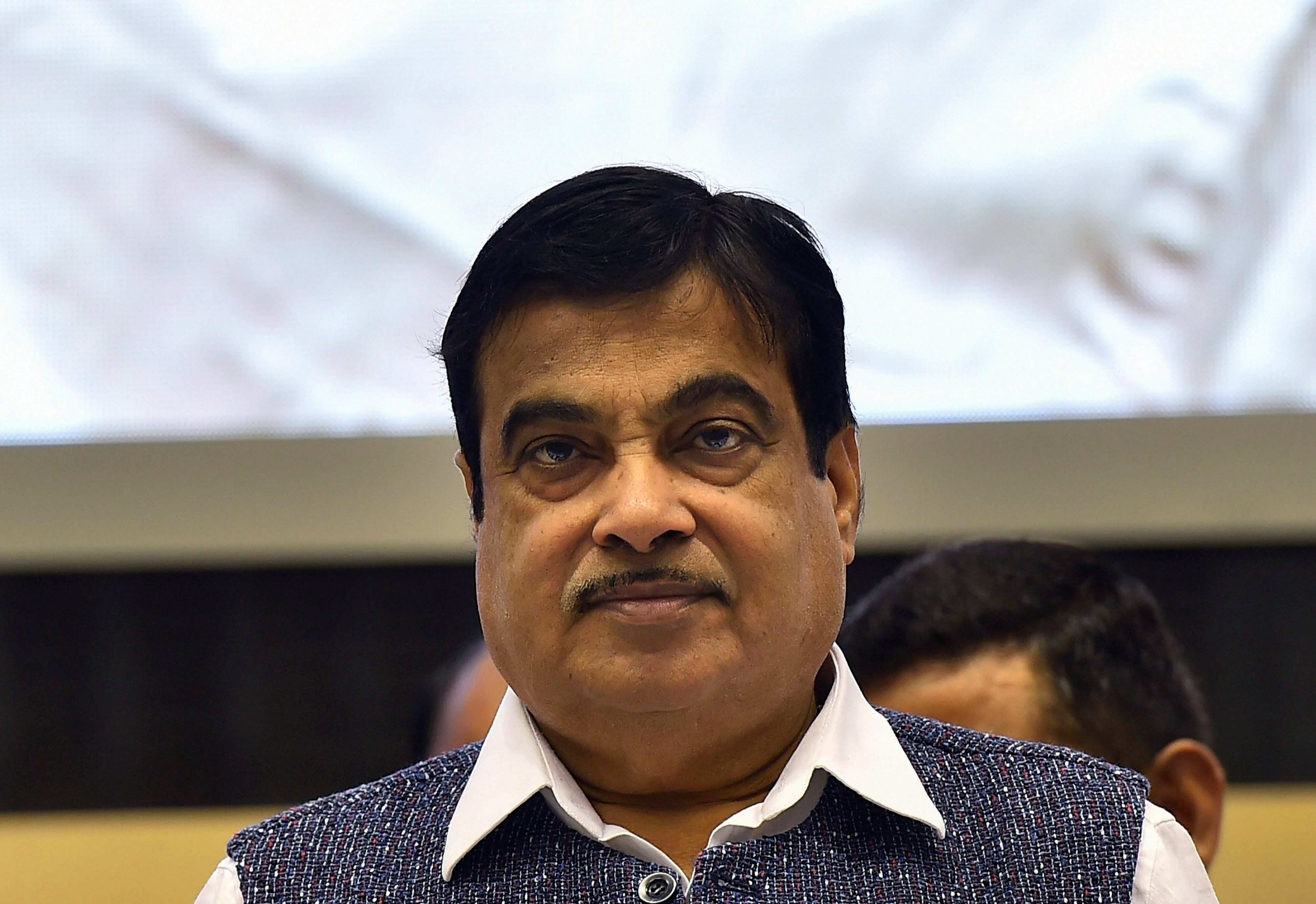 New Delhi: Union Minister for Road Transport and Highways Nitin Gadkari releases a book during inauguration of the 29th National Road Safety Week 2018 in New Delhi on Monday. PTI Photo by Kamal Singh (PTI4_23_2018_000031B)