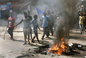 Gaya: People protest during 'Bharat Bandh' call given by Dalit organisations against the alleged dilution of Scheduled Castes / Scheduled Tribes act, in Gaya, Bihar on Monday. PTI Photo(PTI4_2_2018_000048B)