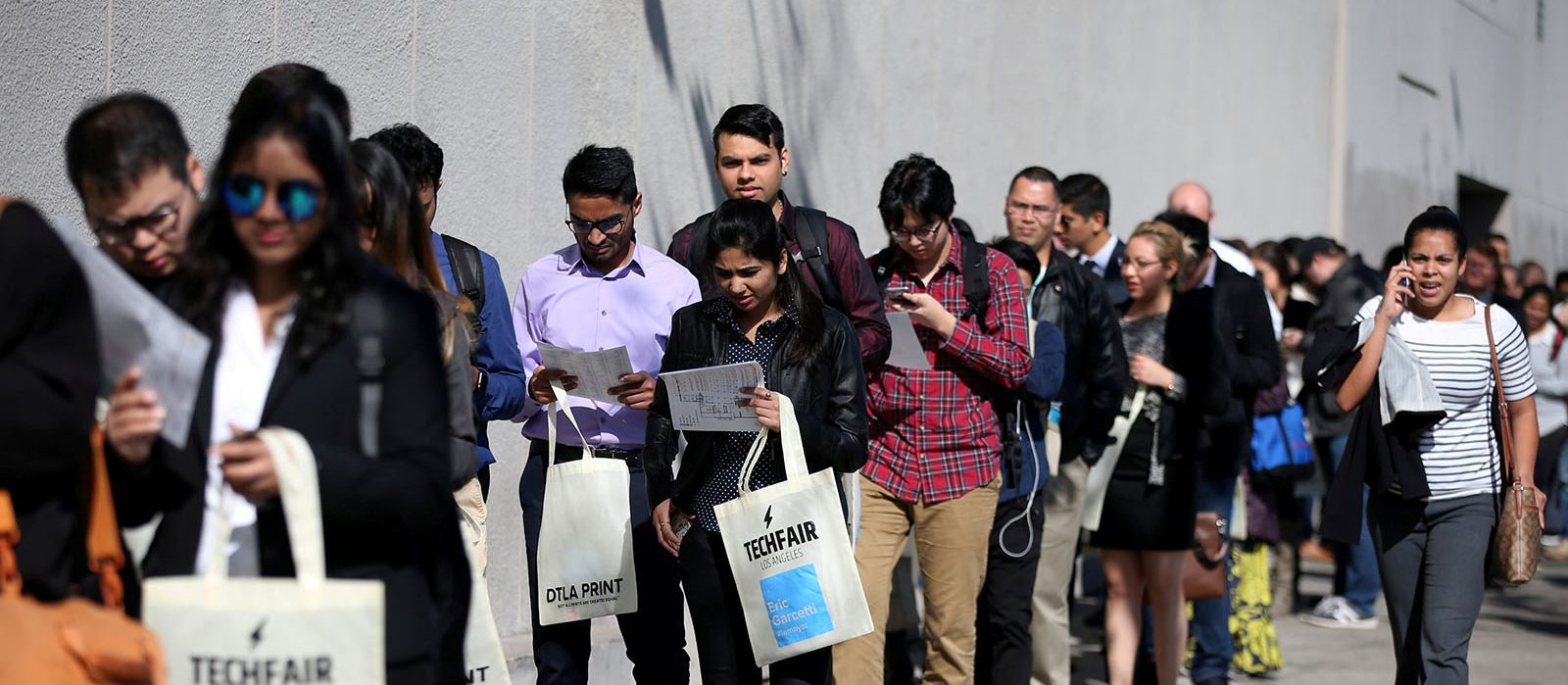 Job applicants wait in line at a technology job fair in Los Angeles. Photo: Reuters