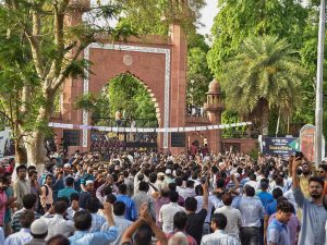 Aligarh: Aligarh Muslim University's Women's College joined in a protest with university students during a protest at the gate of their campus in Aligarh on Thursday. PTI Photo (PTI5_3_2018_000172B)