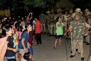 Varanasi: Students and police in a standoff in Varanasi late Saturday night. Female students at the prestigious University were protesting against the administration's alleged victim-shaming after one of them reported an incident of molestation on Thursday. PTI Photo (PTI9_24_2017_000107B)